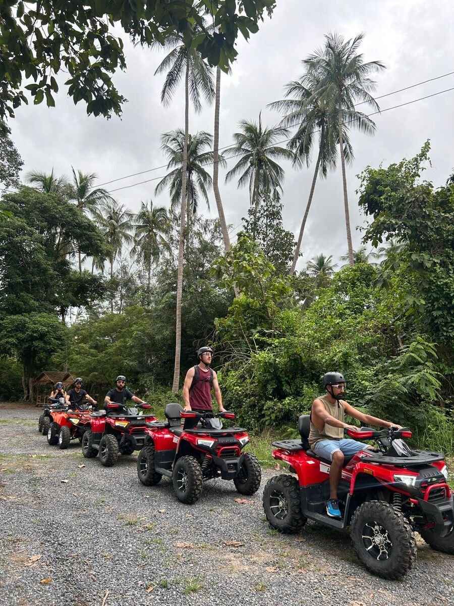 Fleet of brand new ATVs lined up for jungle tour